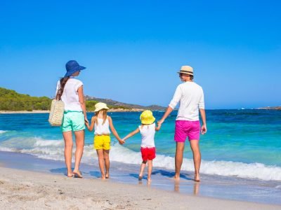 Happy-family-of-four-during-beach