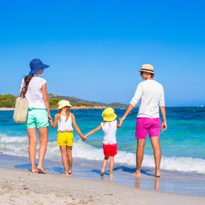 Happy-family-of-four-during-beach